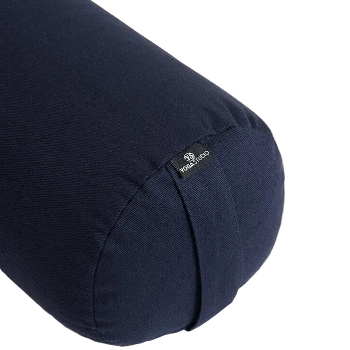 Navy blue yoga bolster with a brand label on a white background
