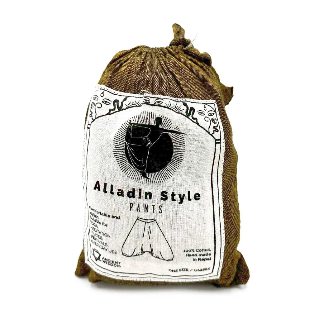 Packaged yoga pants in a cotton pouch with a label on a white background