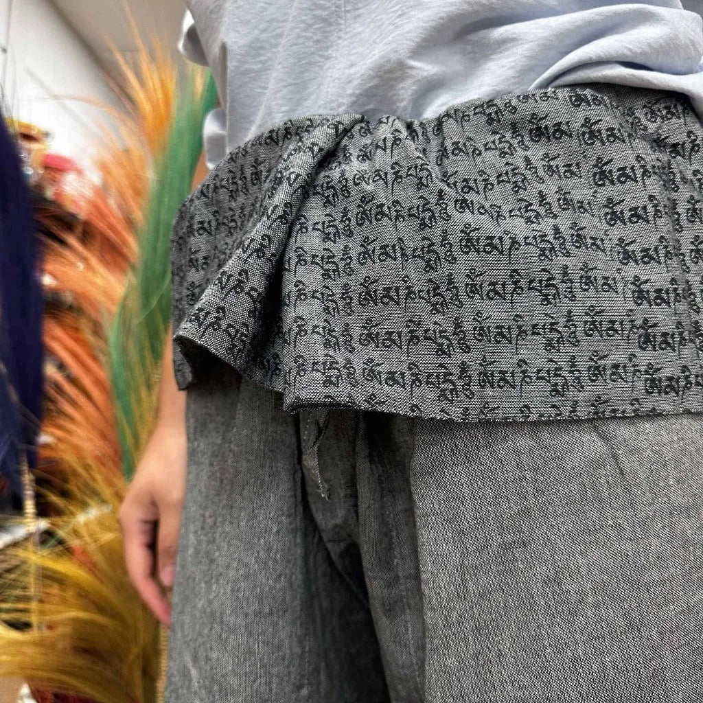 close up shot of grey fisherman style yoga trousers