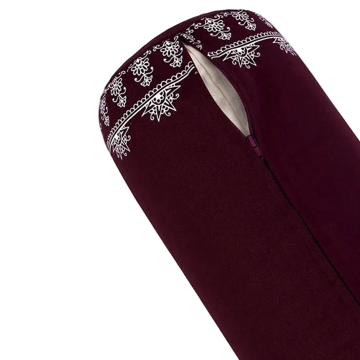 Maroon yoga bolster with white patterns on a white background
