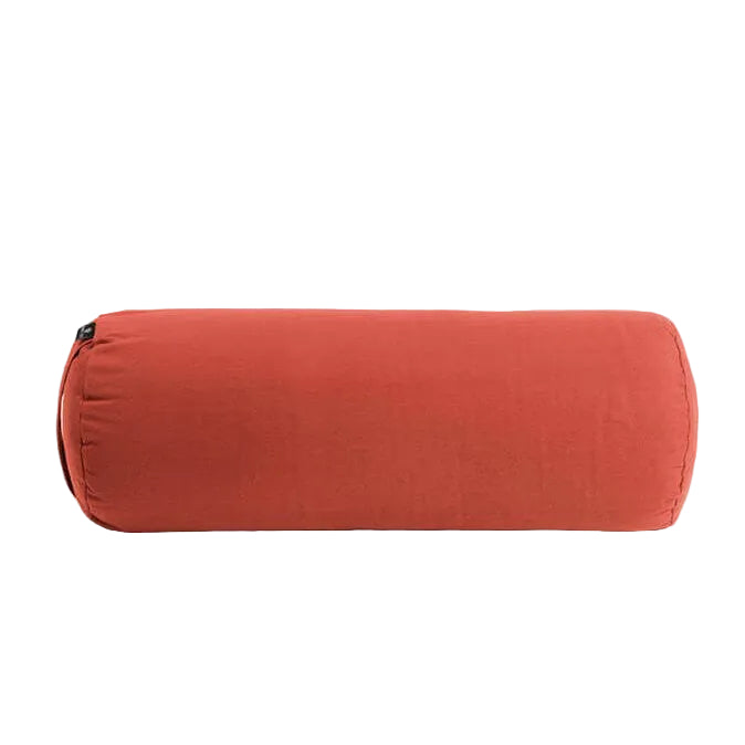 Red cylindrical pillow on a light gray background