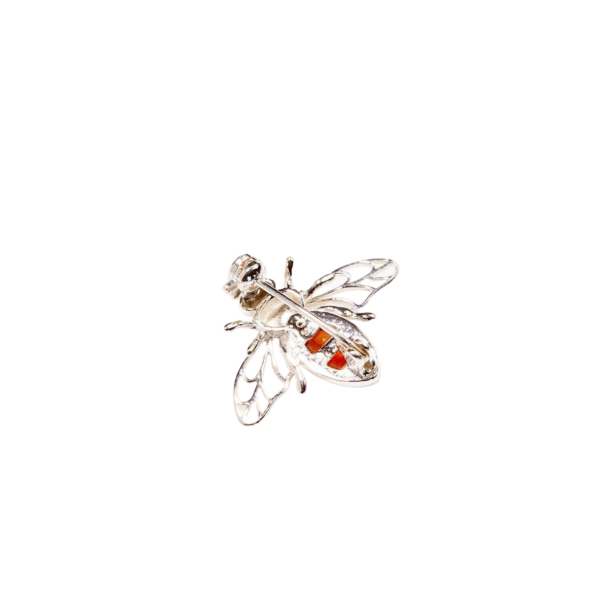Silver bee brooch with amber gemstones on a white background