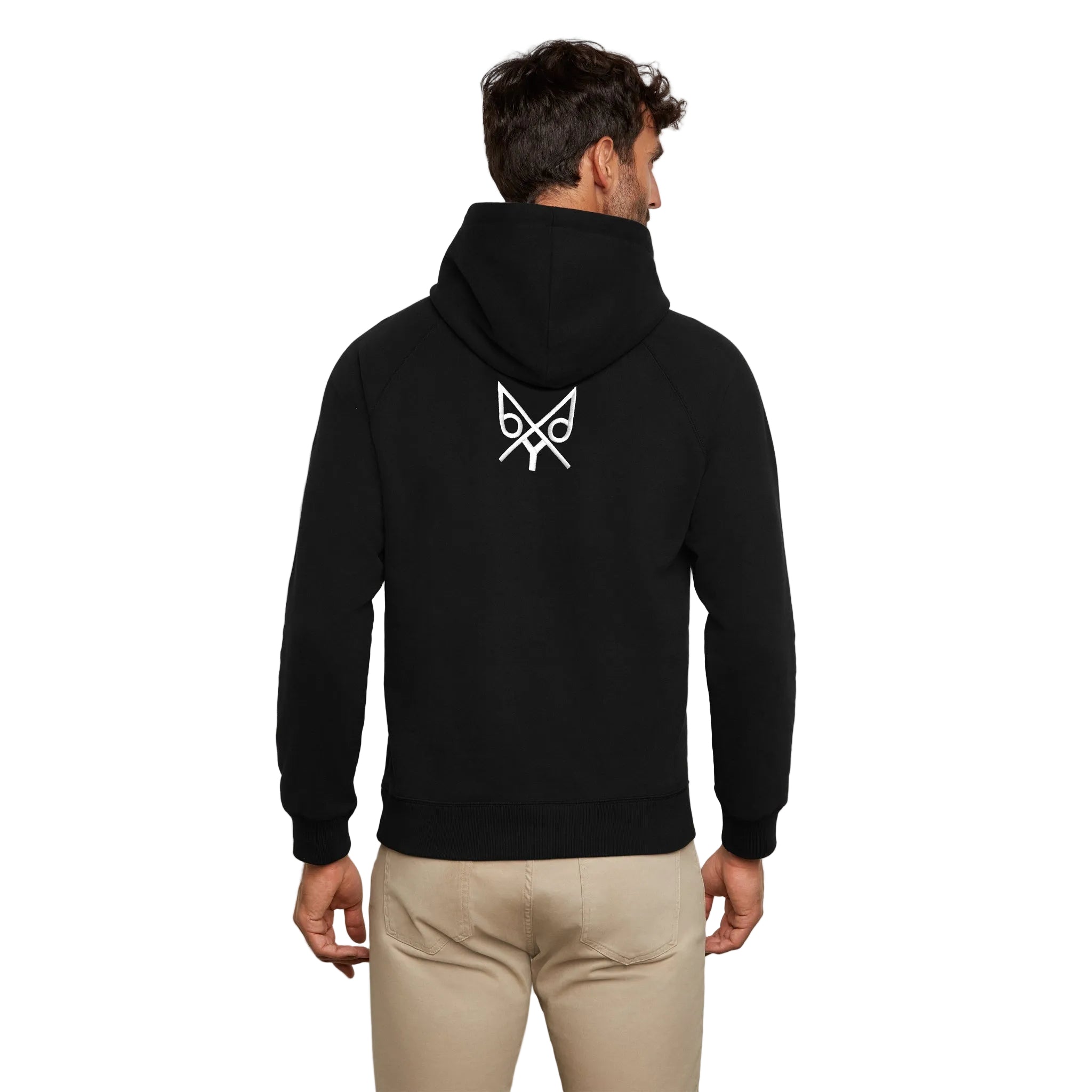 Person wearing a black hoodie with a white logo on the back against a white background