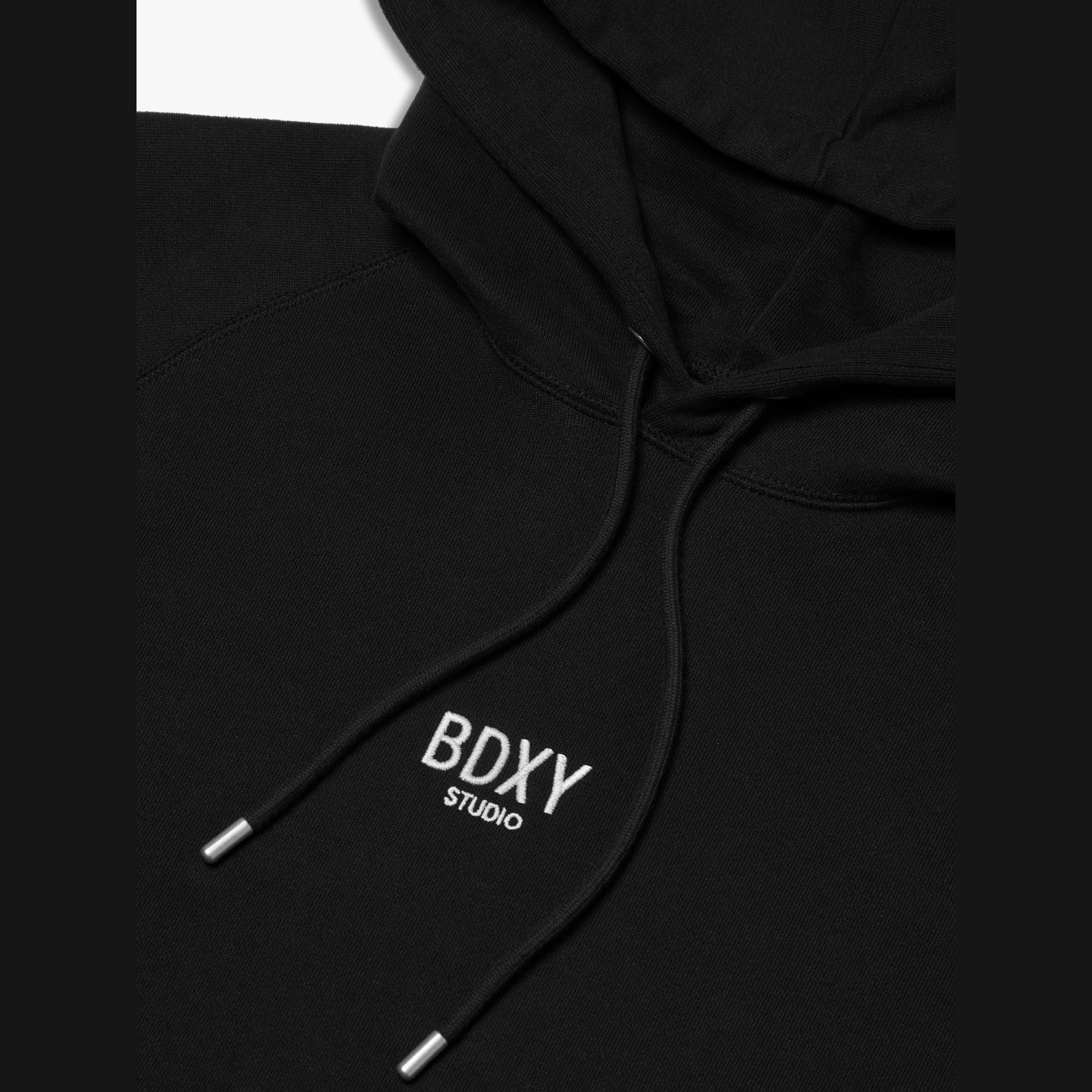 Black hoodie with 'BDXY Studio' logo on a white background