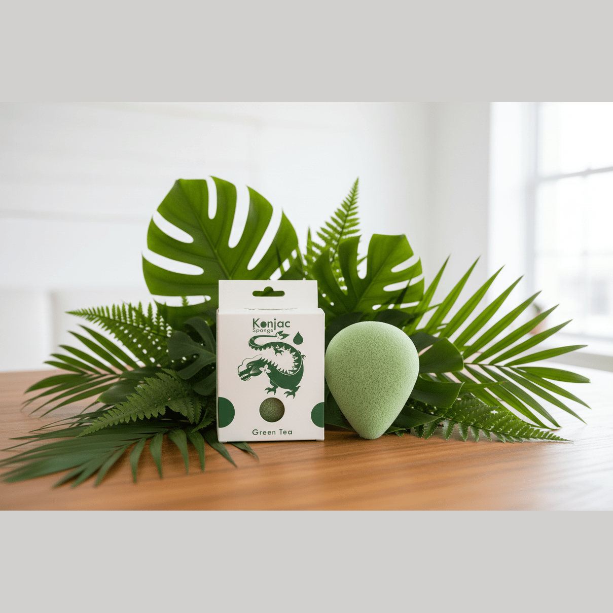 Green tea skincare product with packaging and leaves on a wooden surface