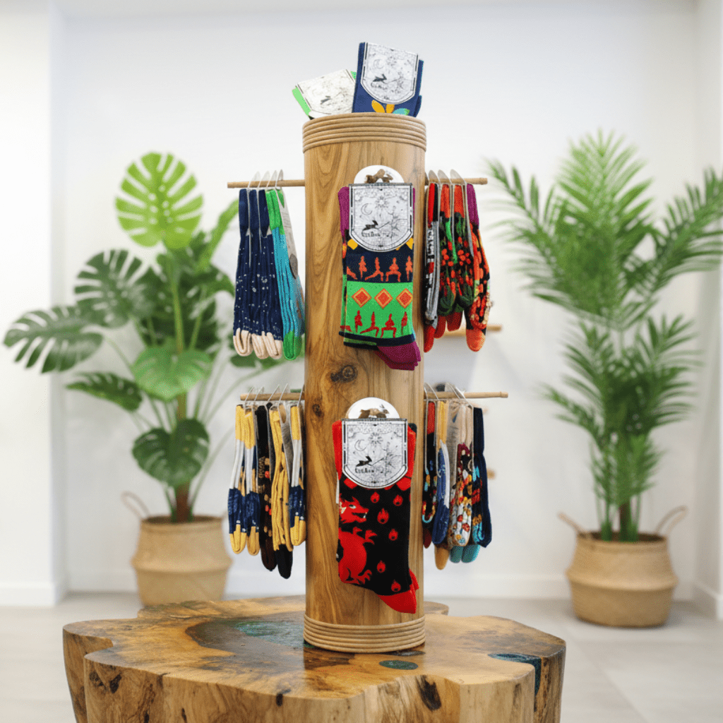 Wooden sock display with colorful socks on a white background