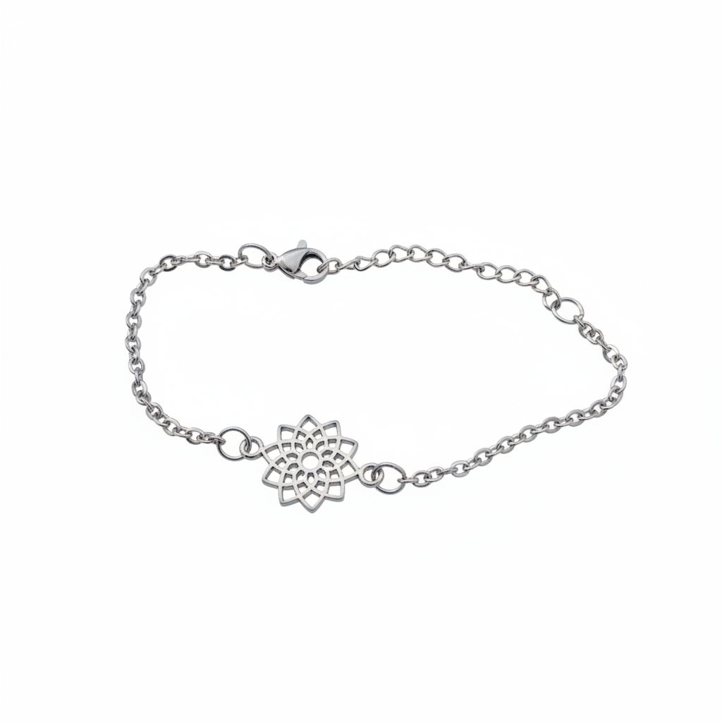 Silver bracelet with a floral design on a white background