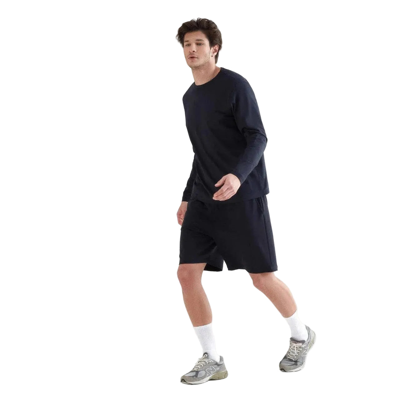 Man wearing a navy long-sleeve shirt and shorts on a white background