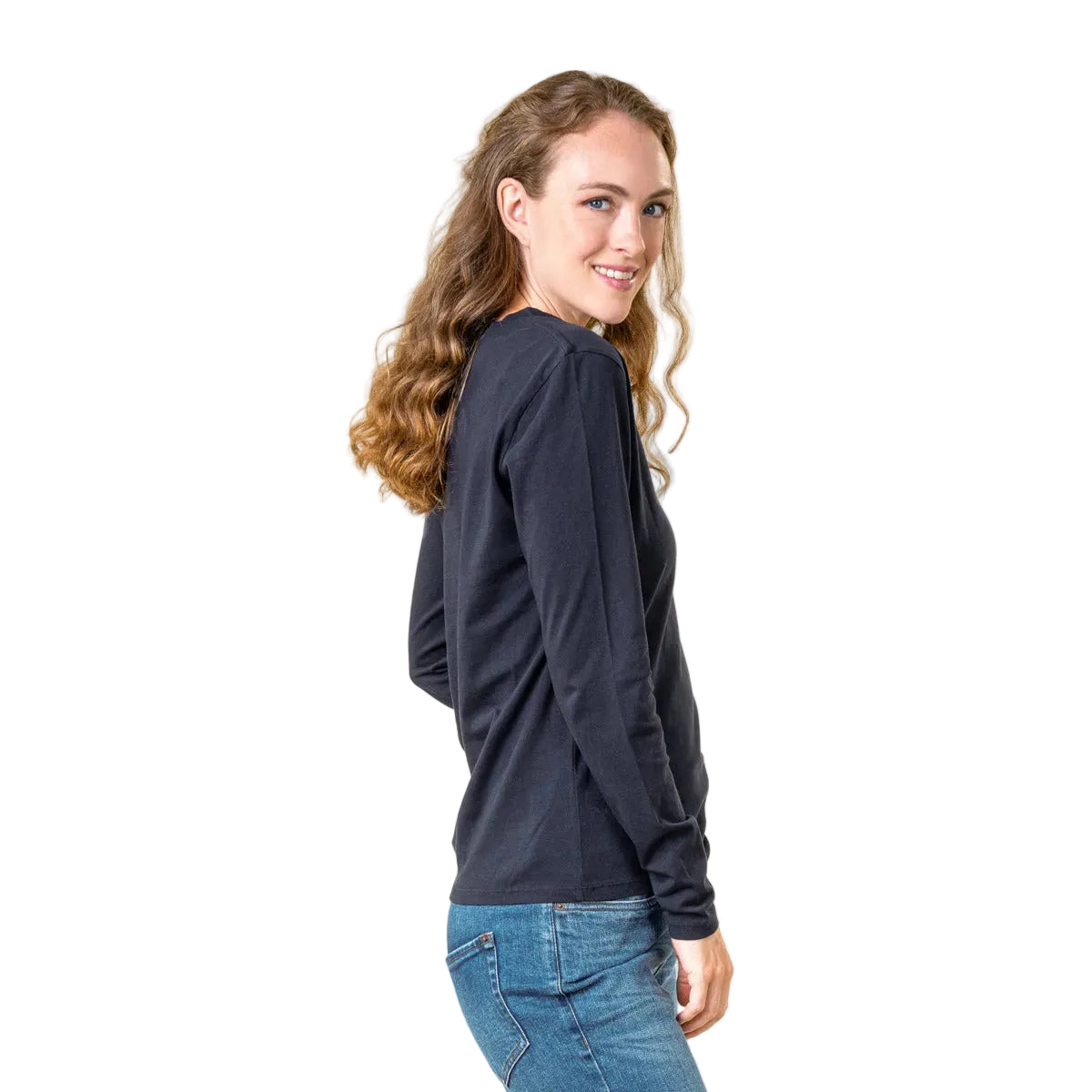 A woman wearing a black long-sleeve shirt and blue jeans on a white background