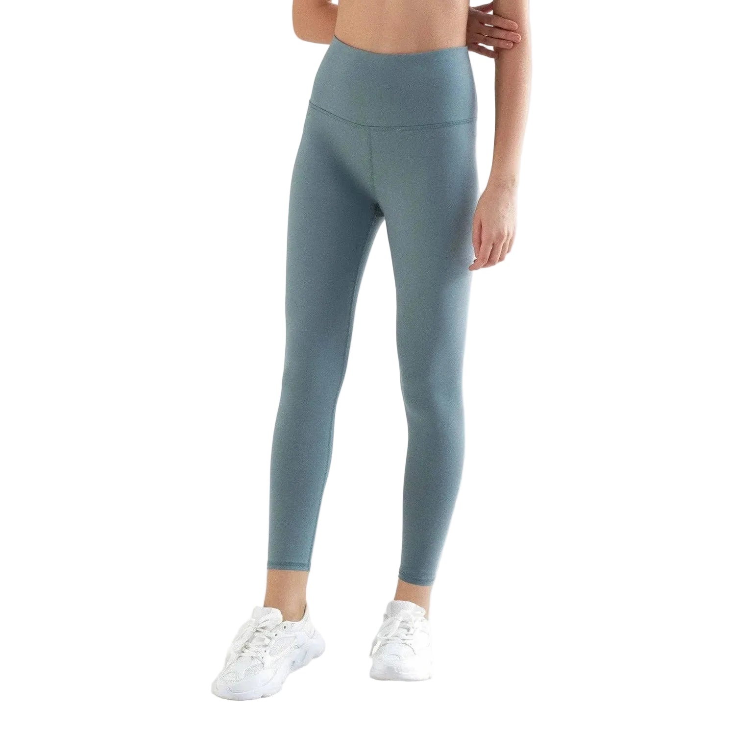 Person wearing light blue leggings on a white background