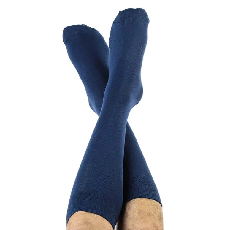 Pair of blue knee-high socks on a white background