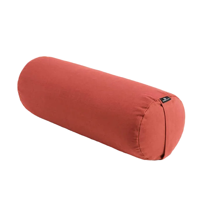 Red cylindrical pillow on a light gray background