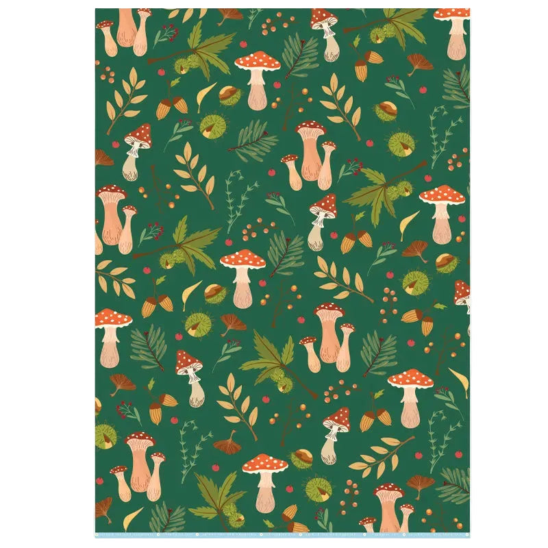 Patterned wrapping paper with mushrooms and foliage on a green backgrounnd
