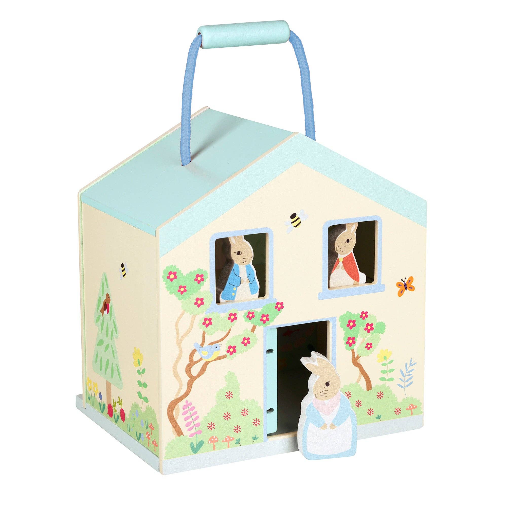 Children's toy house with characters and a garden design on a white background