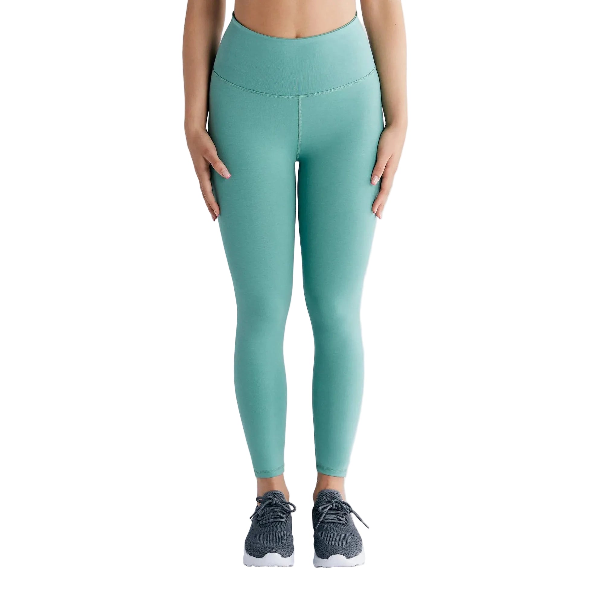 Teal leggings worn by a person on a light gray background
