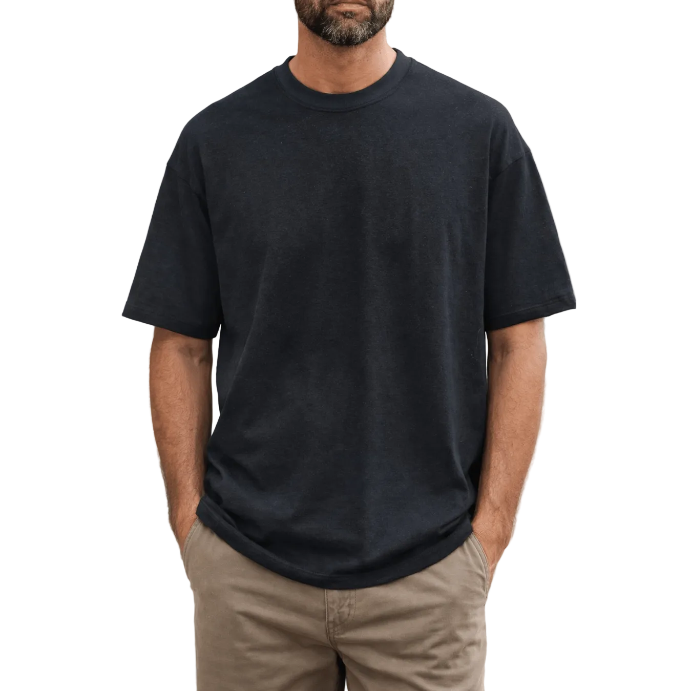 Man wearing a black bamboo t-shirt and beige pants against a white background