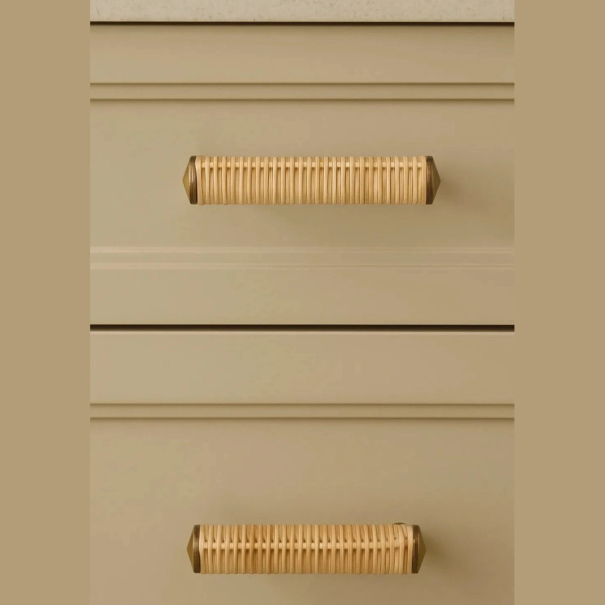 Druridge rattan bar handles fitted horizontally to cream drawer fronts