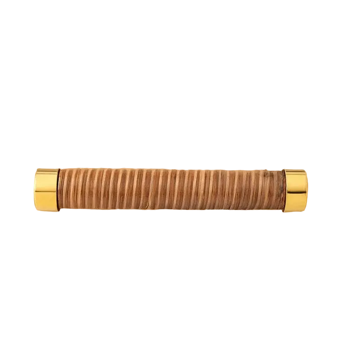 Coquet rattan-wrapped bar handle with gold-coloured end fittings on a white background