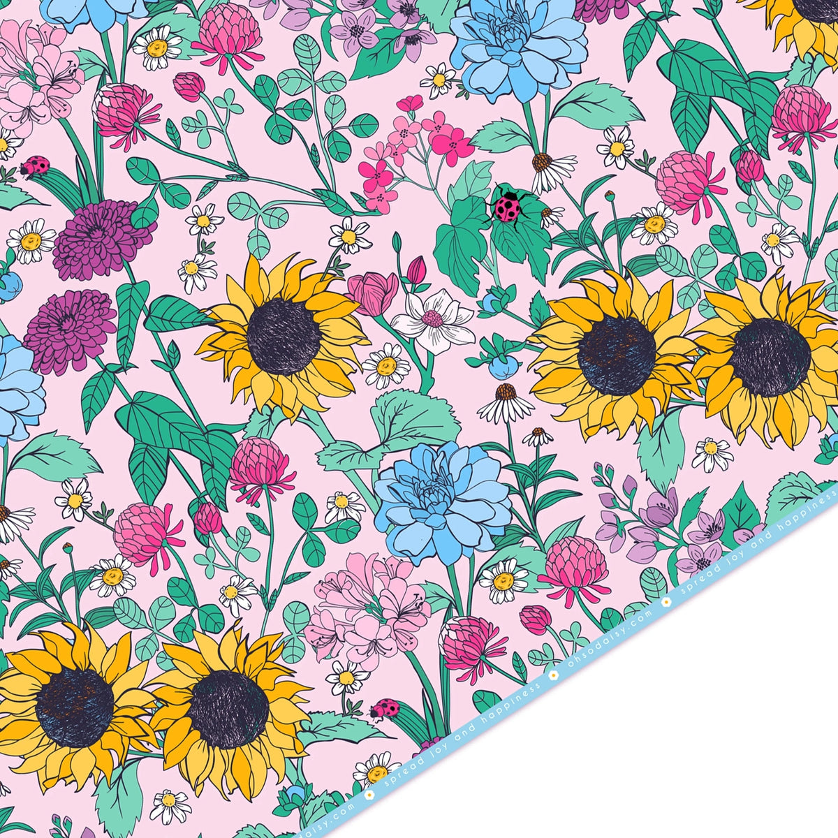 Colourful floral patterned giftwrap paper with sunflowers on a pink background