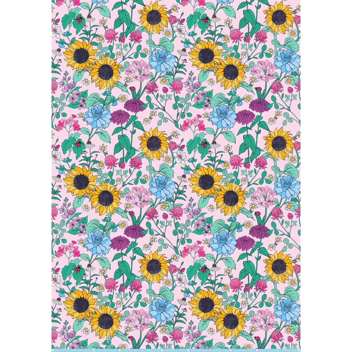 Floral patterned sheet of giftwrap with sunflowers and other flowers on a pink background
