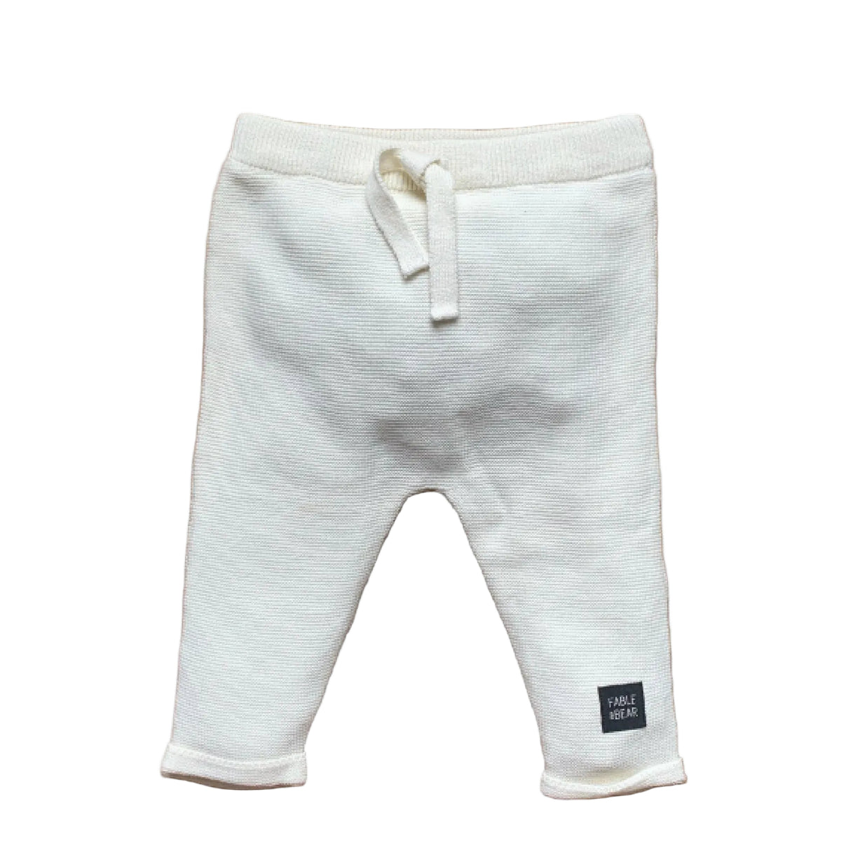White knitted organic cotton baby joggers with adjustable ankle cuffs