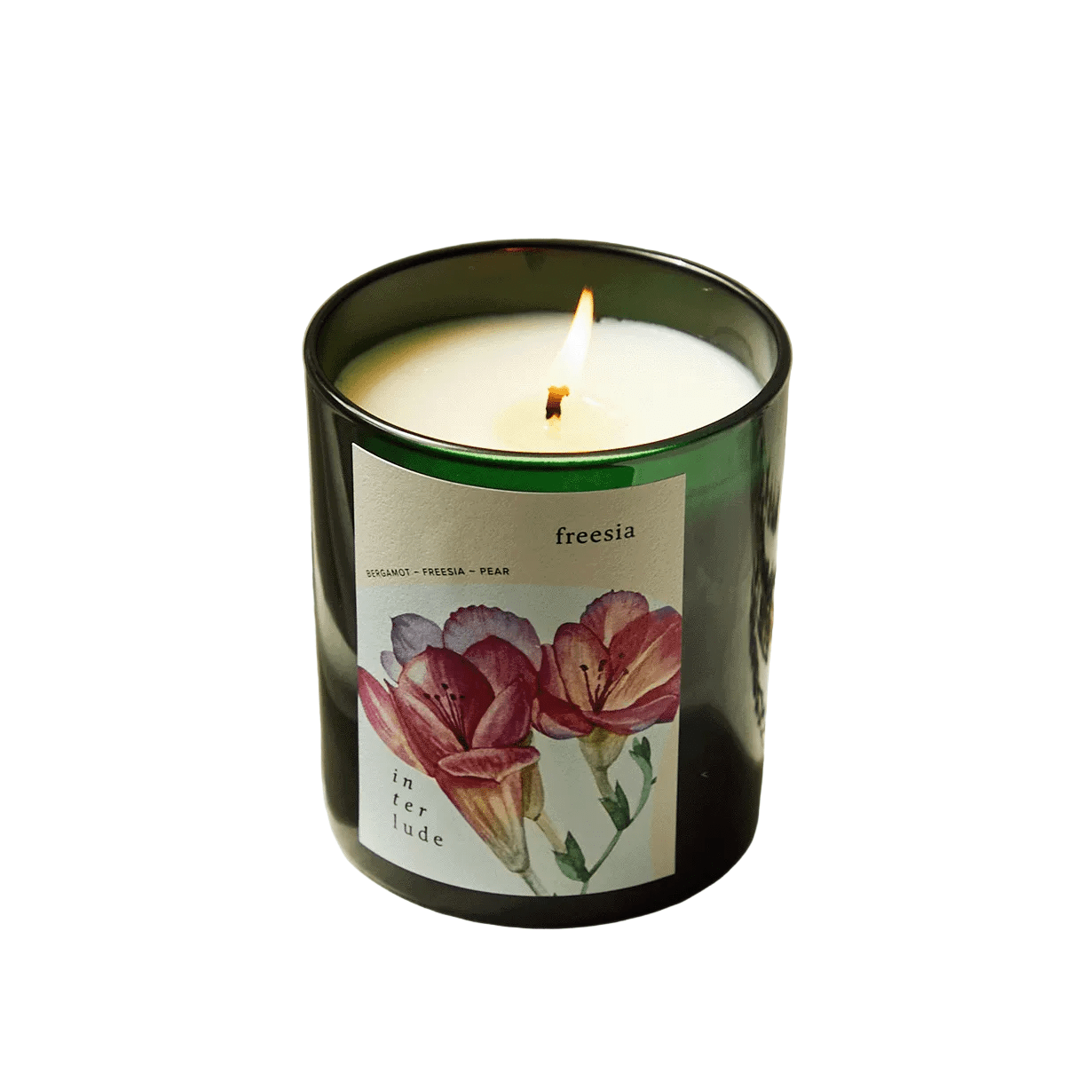 Freesia scented candle in a glass container with a floral label on a white background