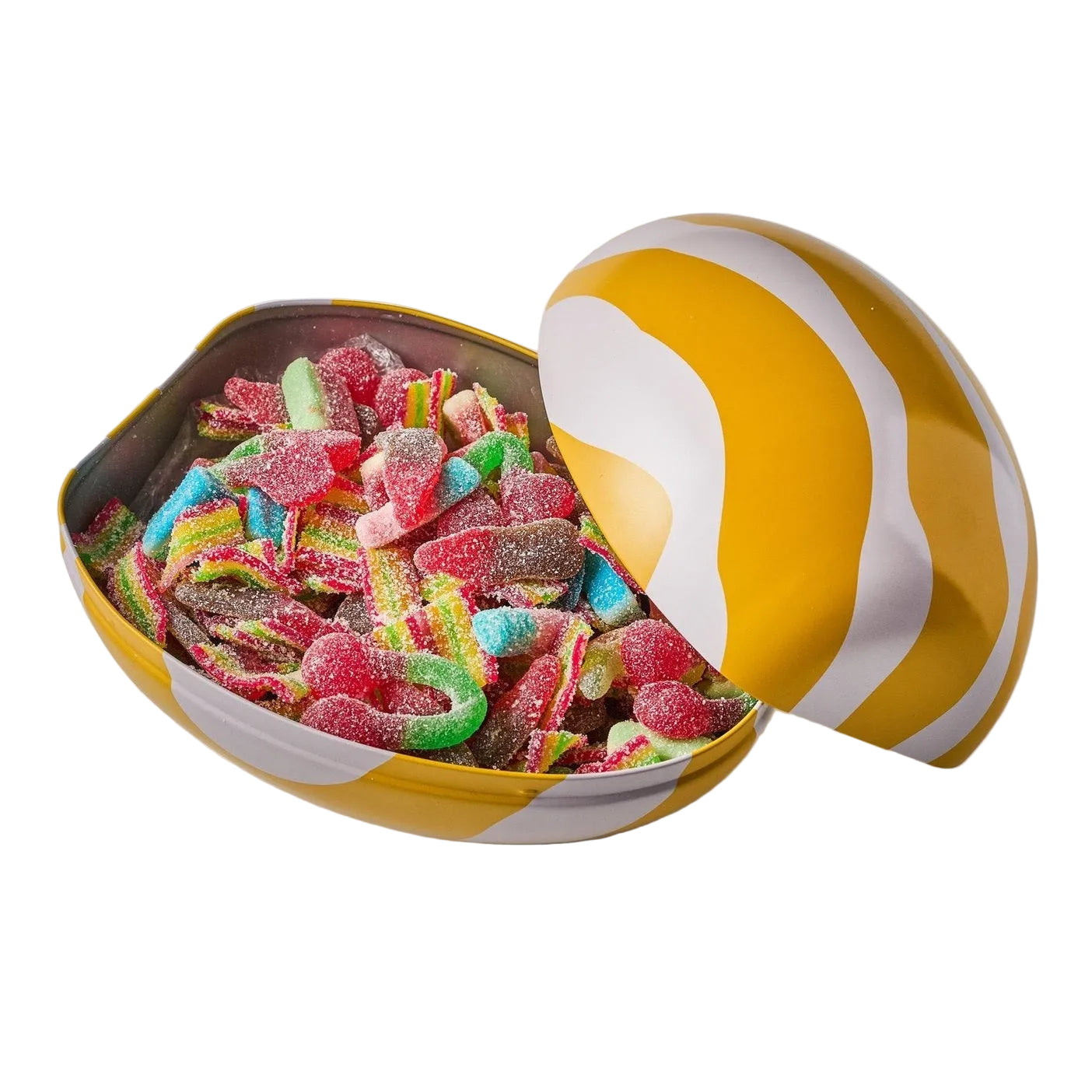Yellow and white striped Easter egg filled with colourful gummy worms on a light background