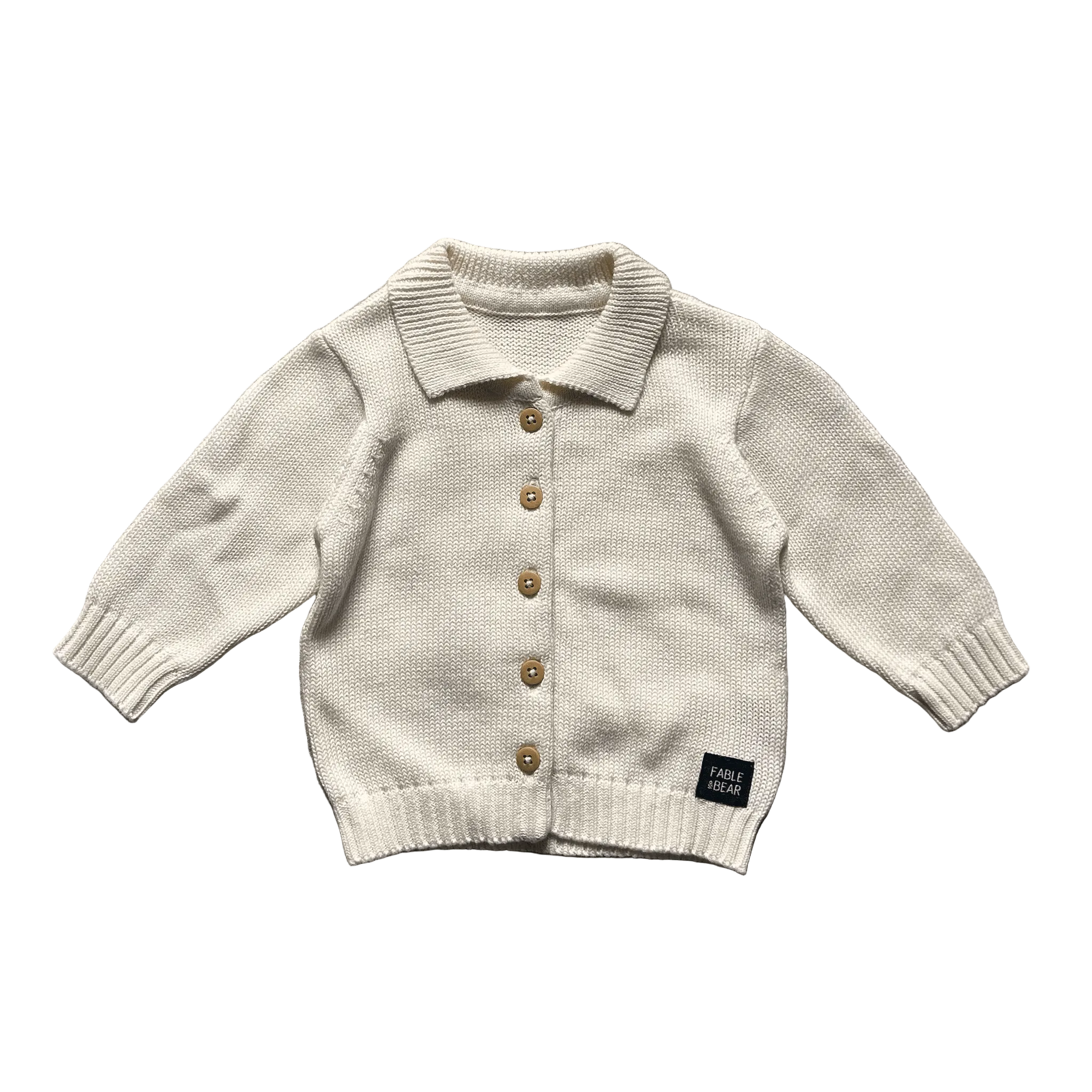 Ivory knitted baby cardigan with button details on a white background