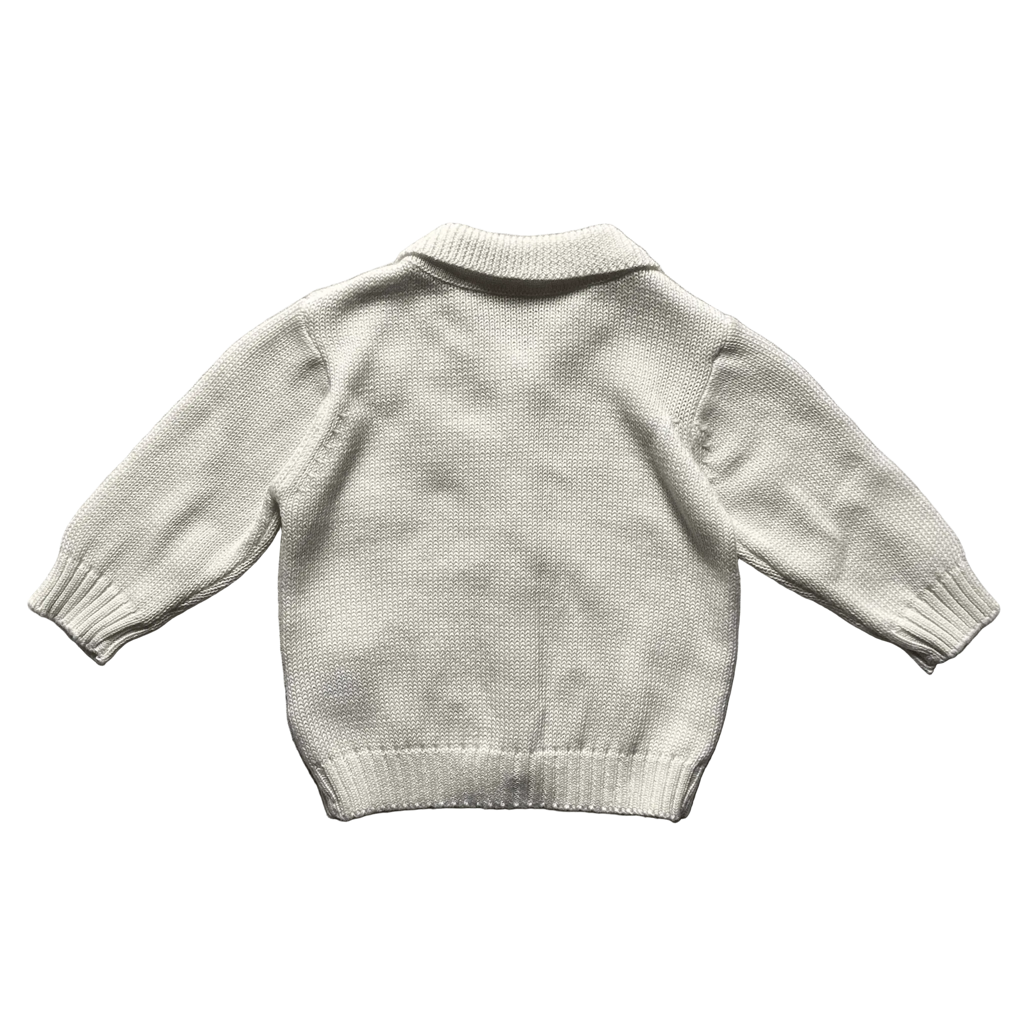 Ivory toddler cardigan on a white background