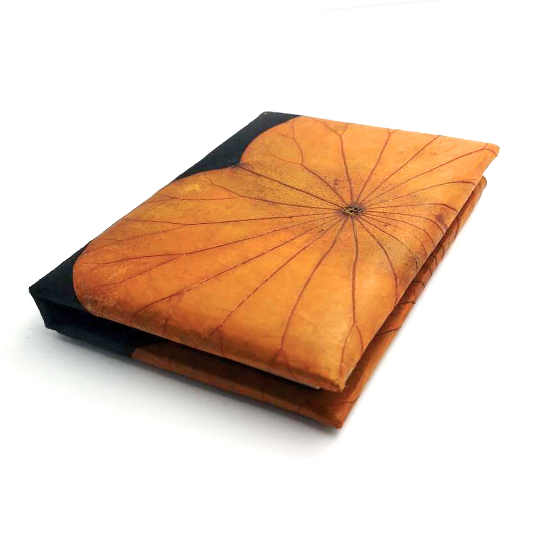 A notebook with an orange leaf pattern on a white background