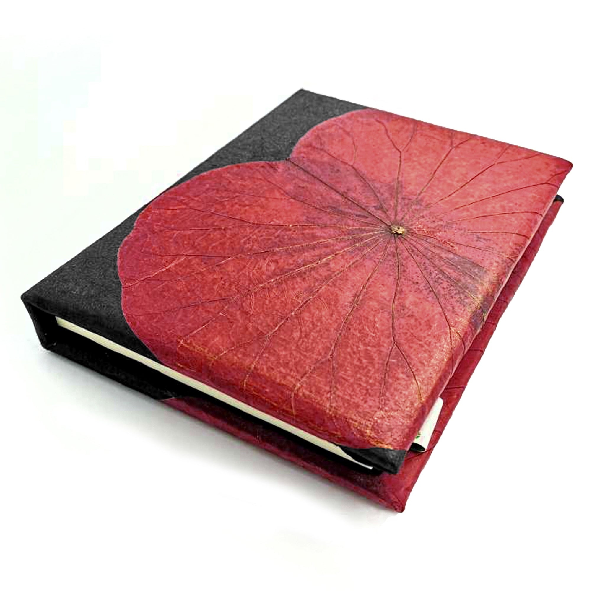 Notebook with a red leaf design on a black cover against a white background