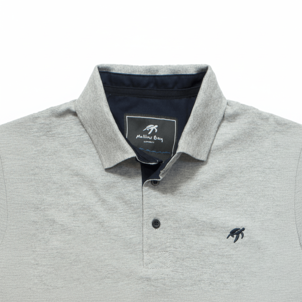 Grey polo shirt with collar and brand logo on a white background