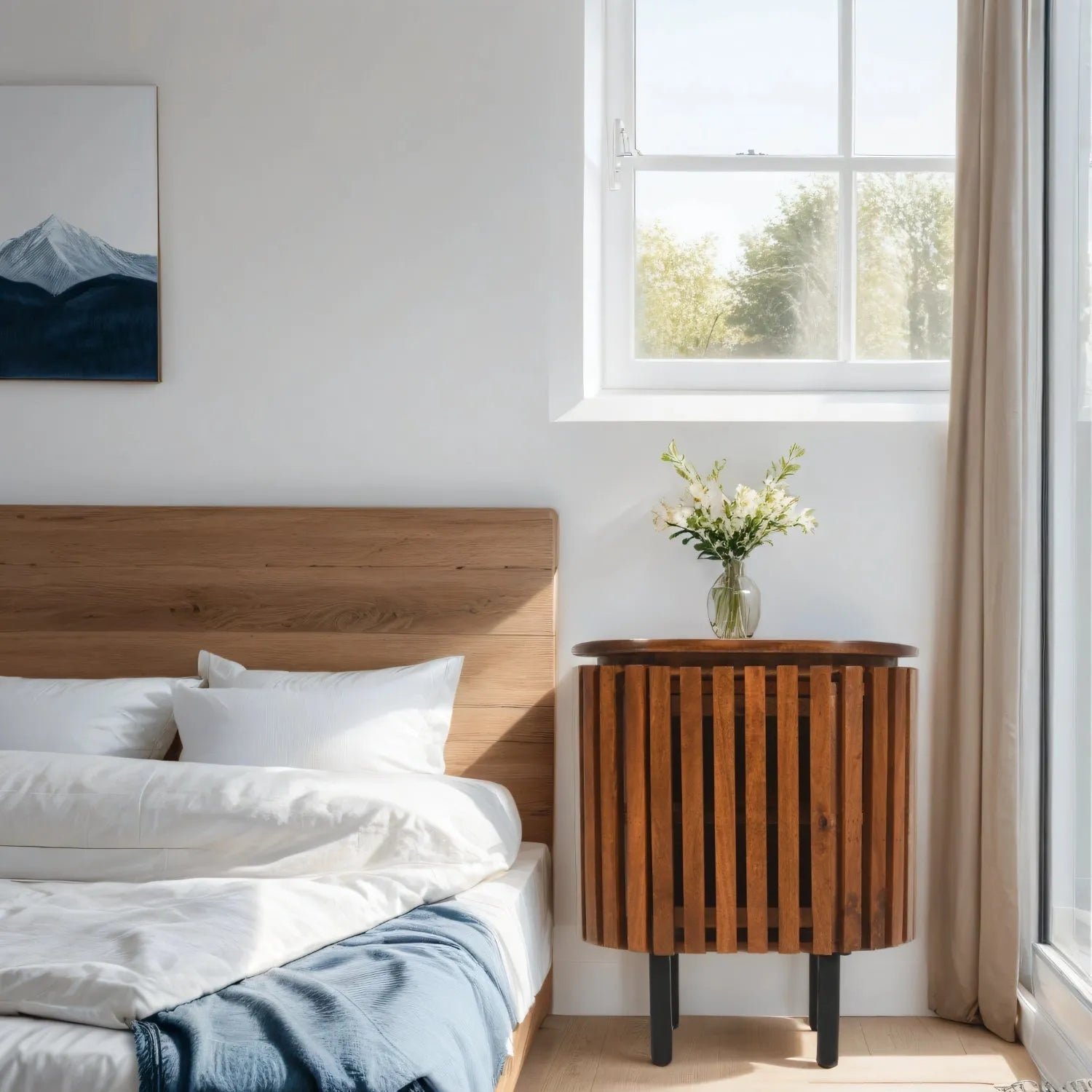 Verty Furniture Compton Mango Wood Bedside Table in a modern light bedroom with a wooden floor and wooden furniture