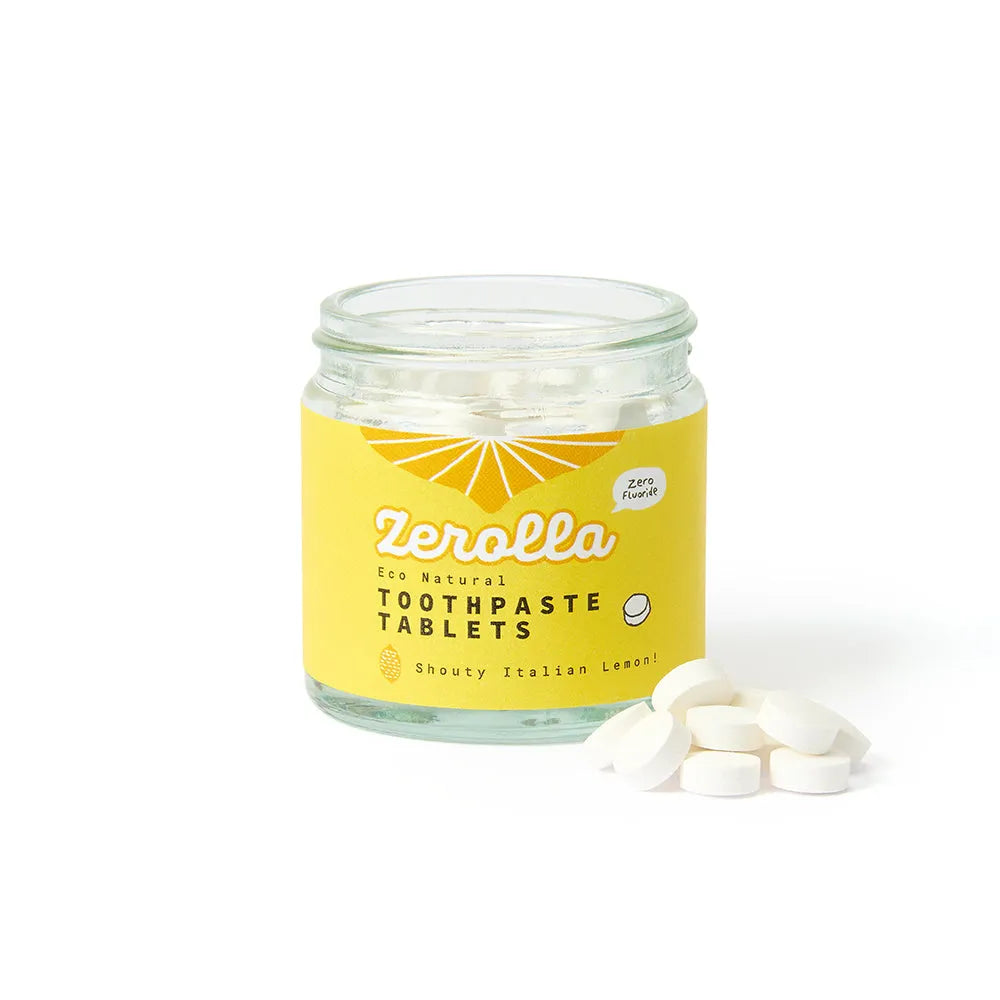 Jar of Zerolla lemon toothpaste tablets with a yellow label on a white background