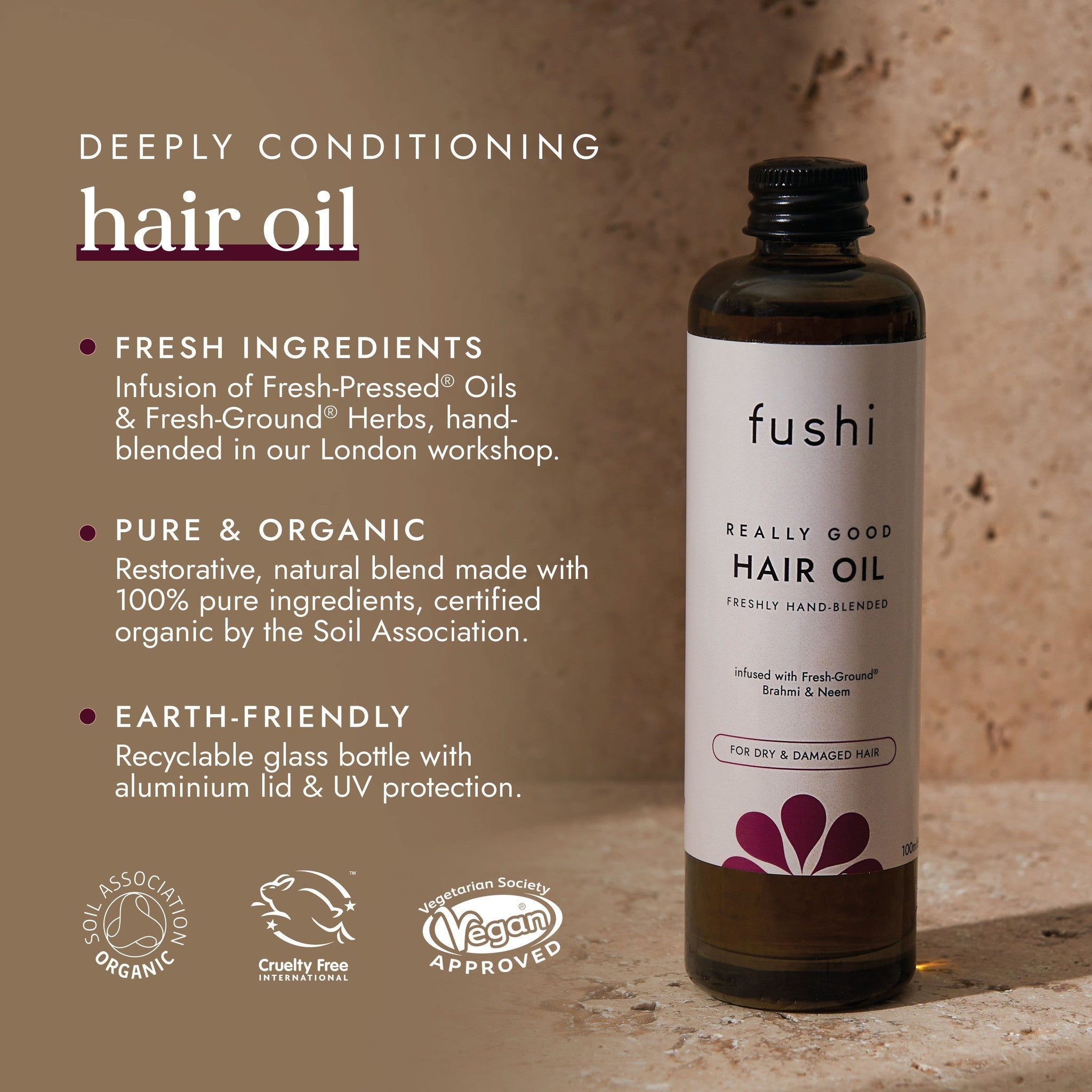 Fushi hair oil bottle with product details on a brown background