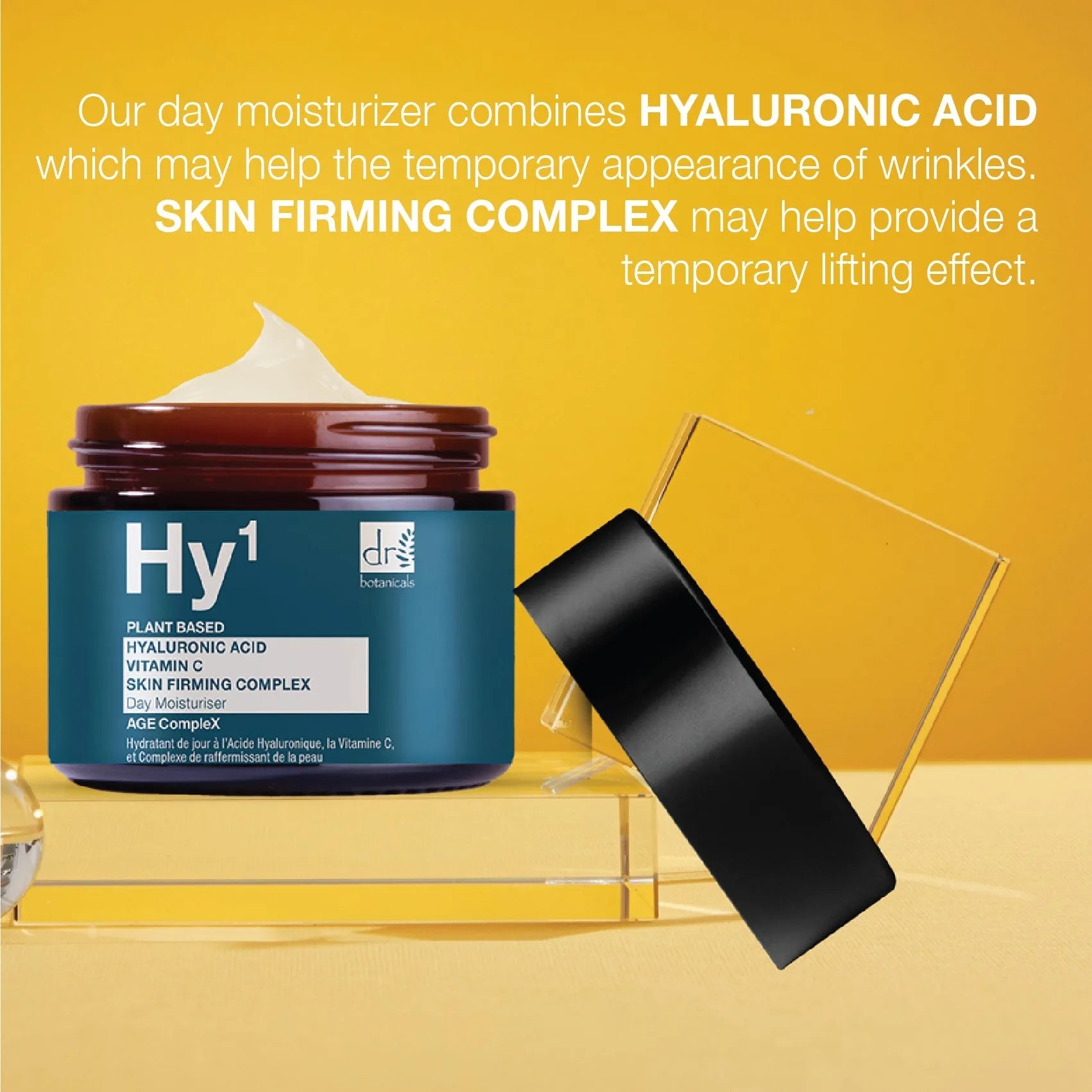 Hydrating cream jar with text about hyaluronic acid and skin firming complex on a yellow background