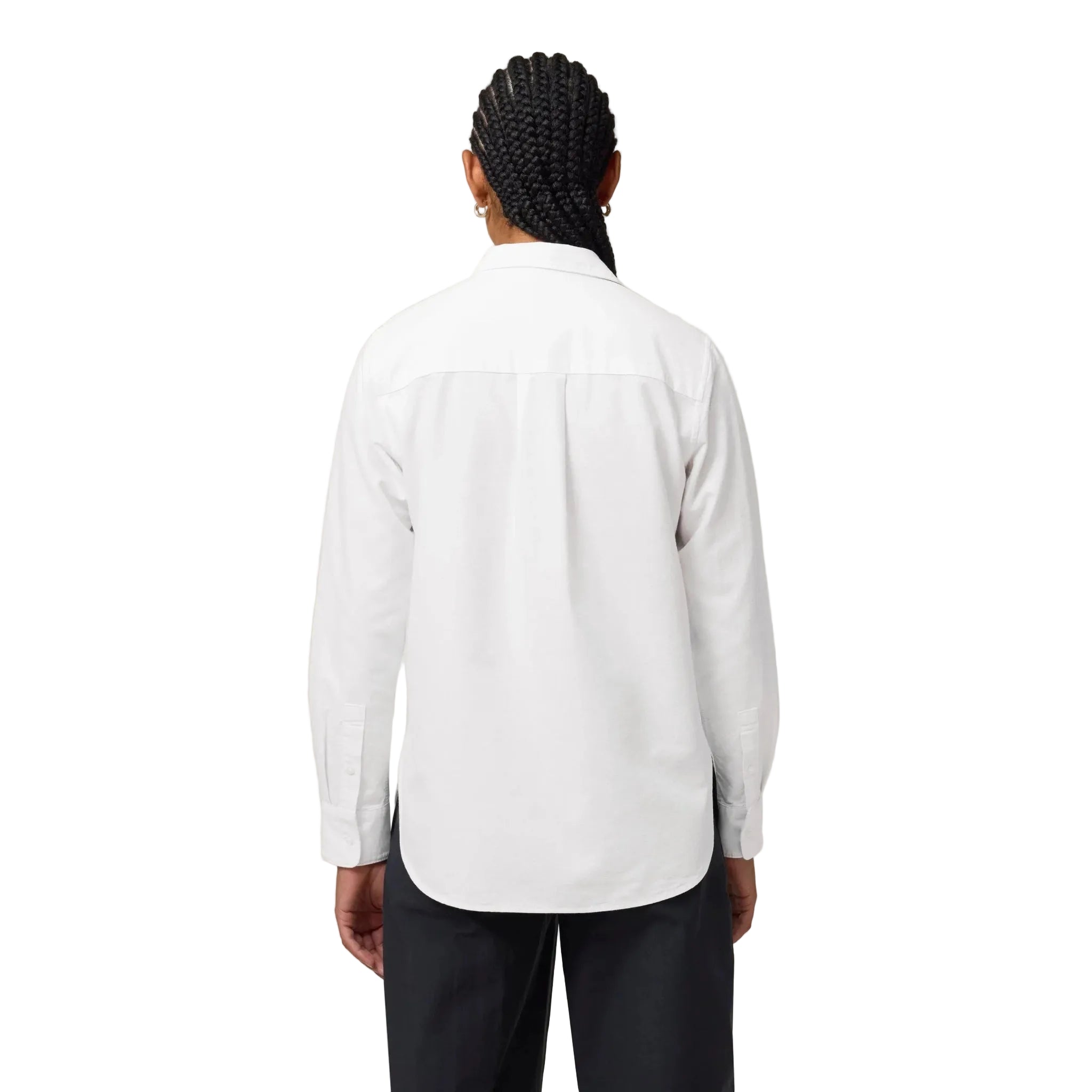 Person wearing a white shirt and black pants against a white background