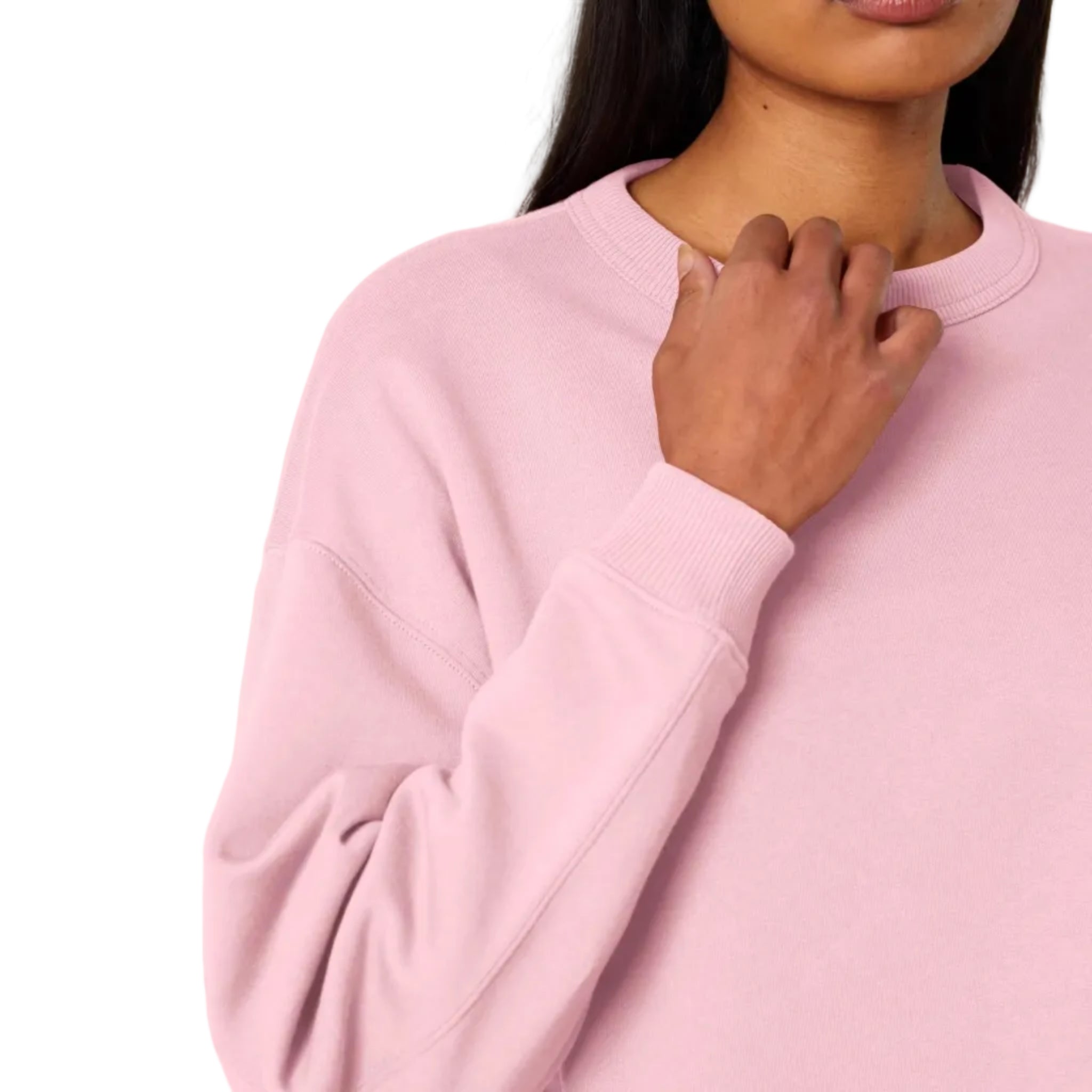 Person wearing a pink sweatshirt with a plain background