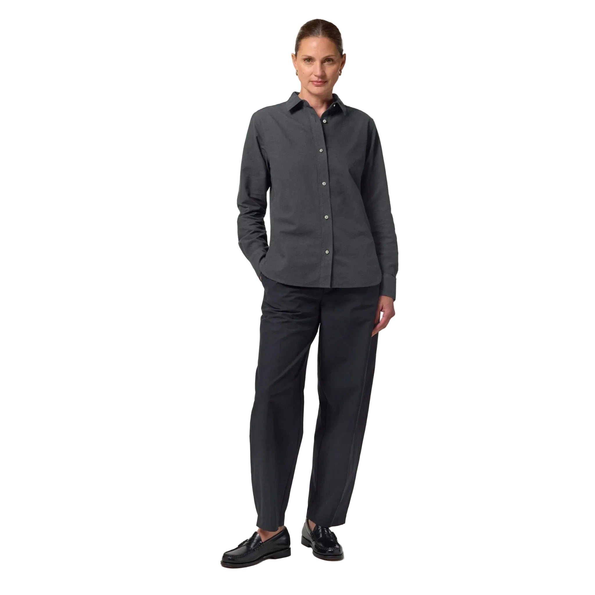 Woman wearing a gray shirt and black pants on a white background
