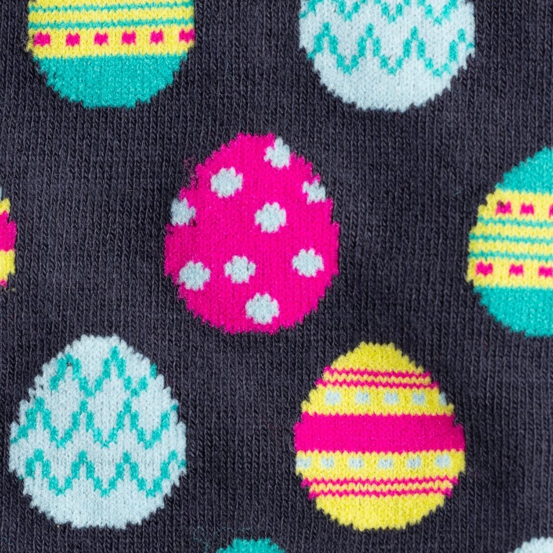 Colorful Easter egg pattern on a dark background