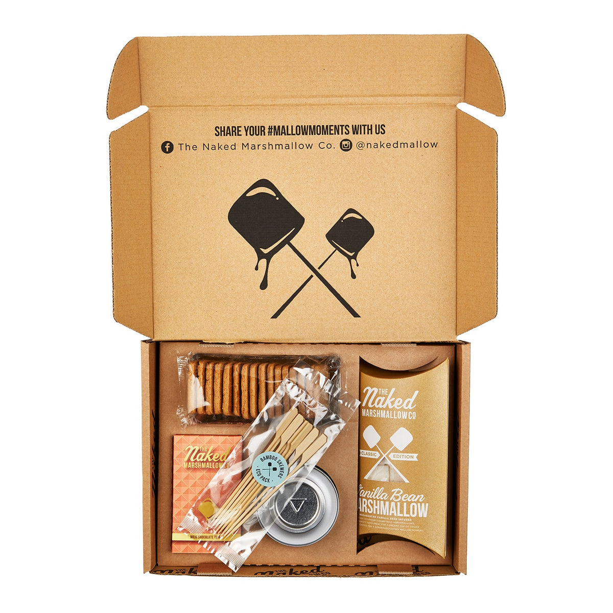 Open cardboard box containing Naked Marshmallow Co. products on a white background