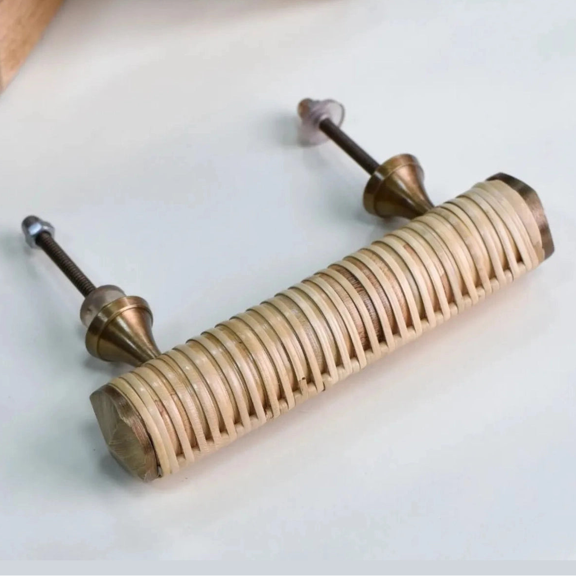 Rear view of a Druridge rattan bar handle showing two fixing bolts