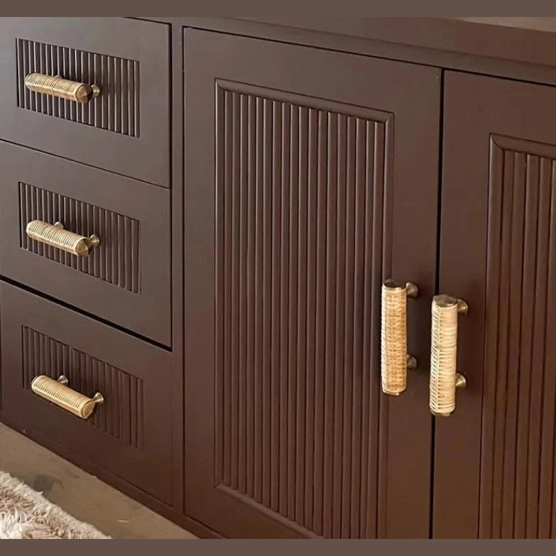 Close-up of Dunstanburgh rattan handles fitted horizontally and vertically to fluted brown cabinetry