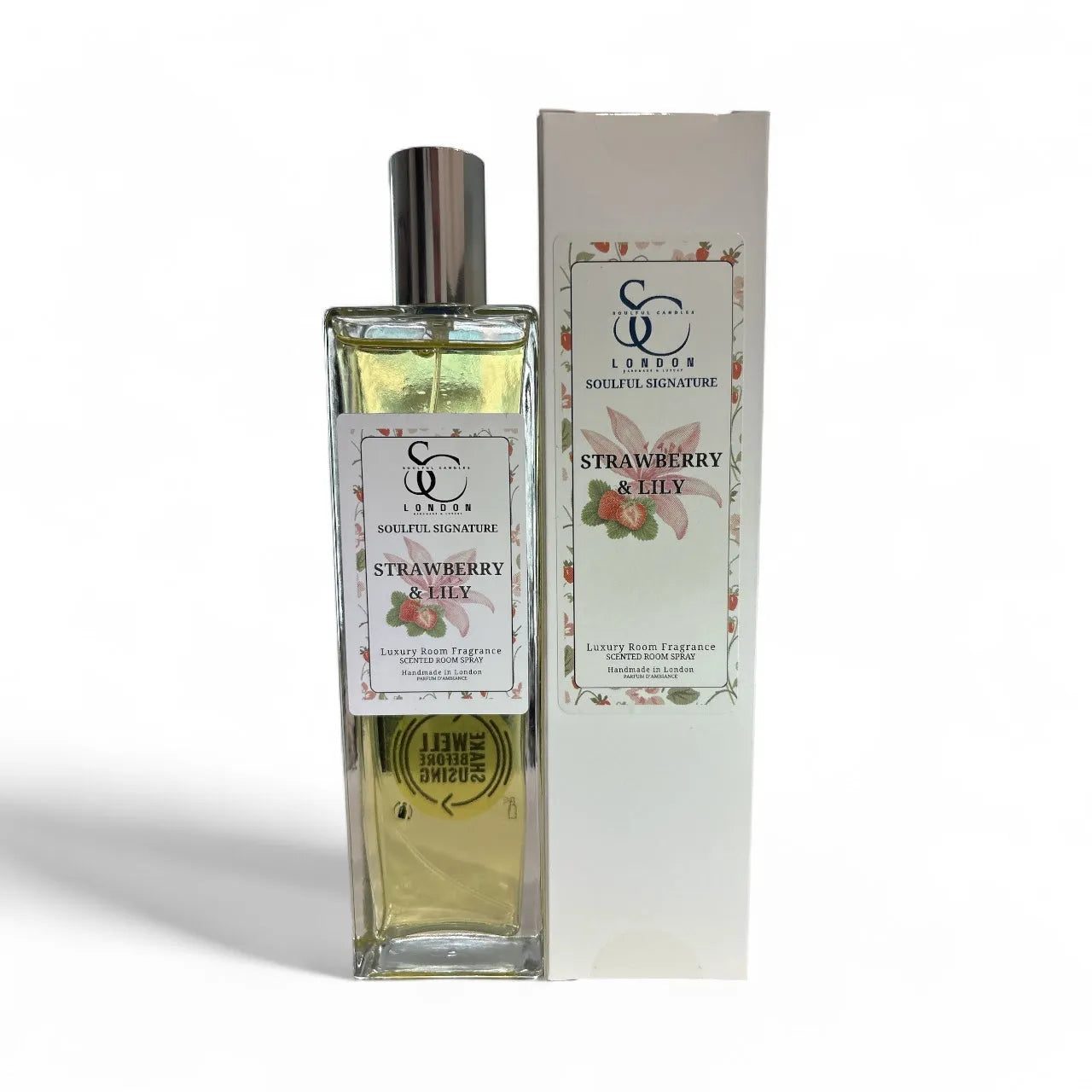 Bottle of Strawberry & Lily room spray with packaging on a white background