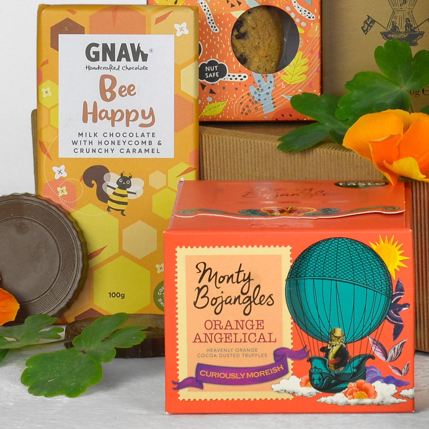 Chocolate bars with colorful packaging featuring branding and product names.