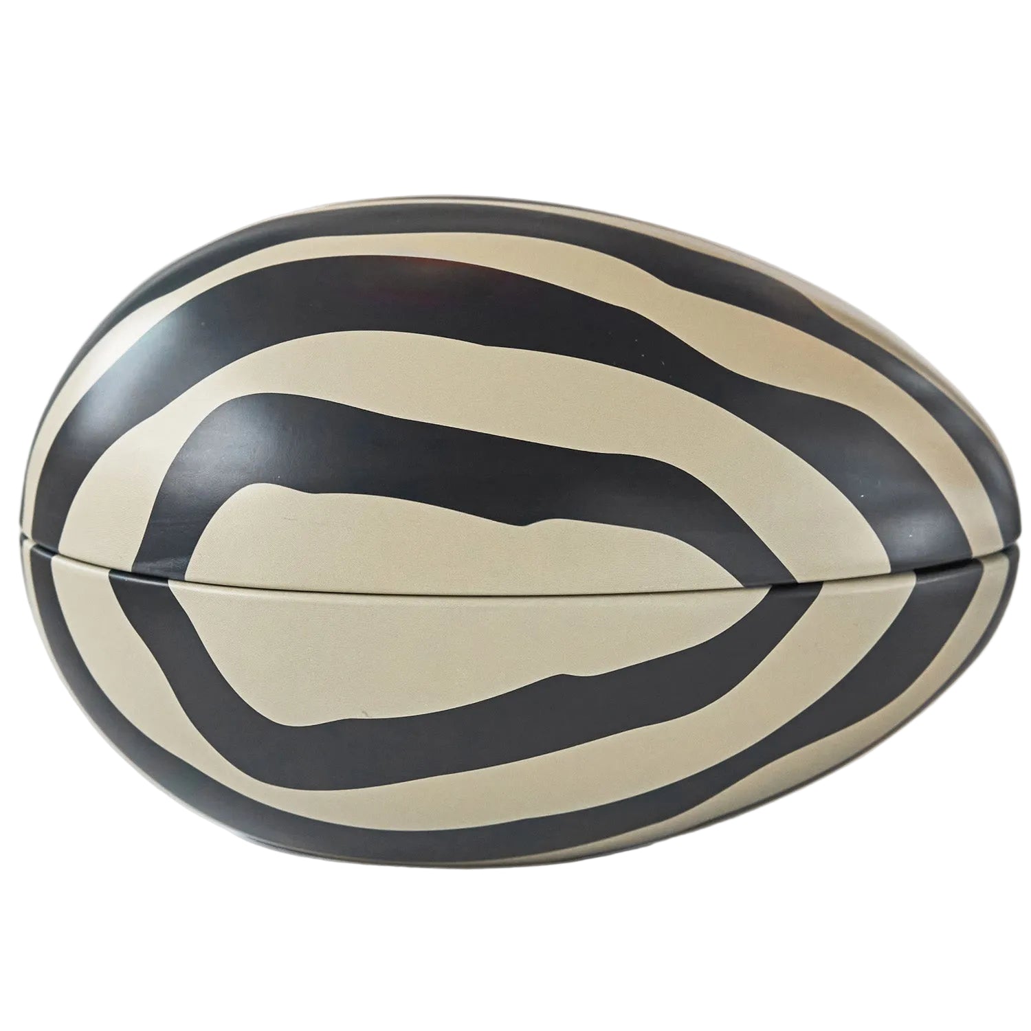 Black and beige striped refillable Easter egg on a white background