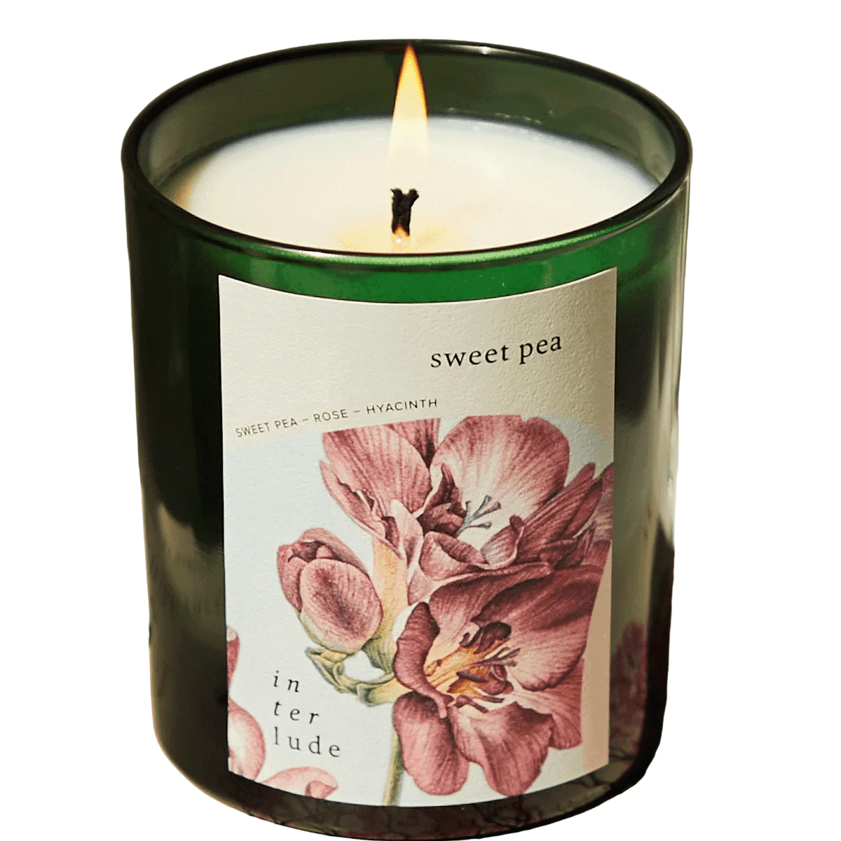 Candle in a green container with a floral label on a white background