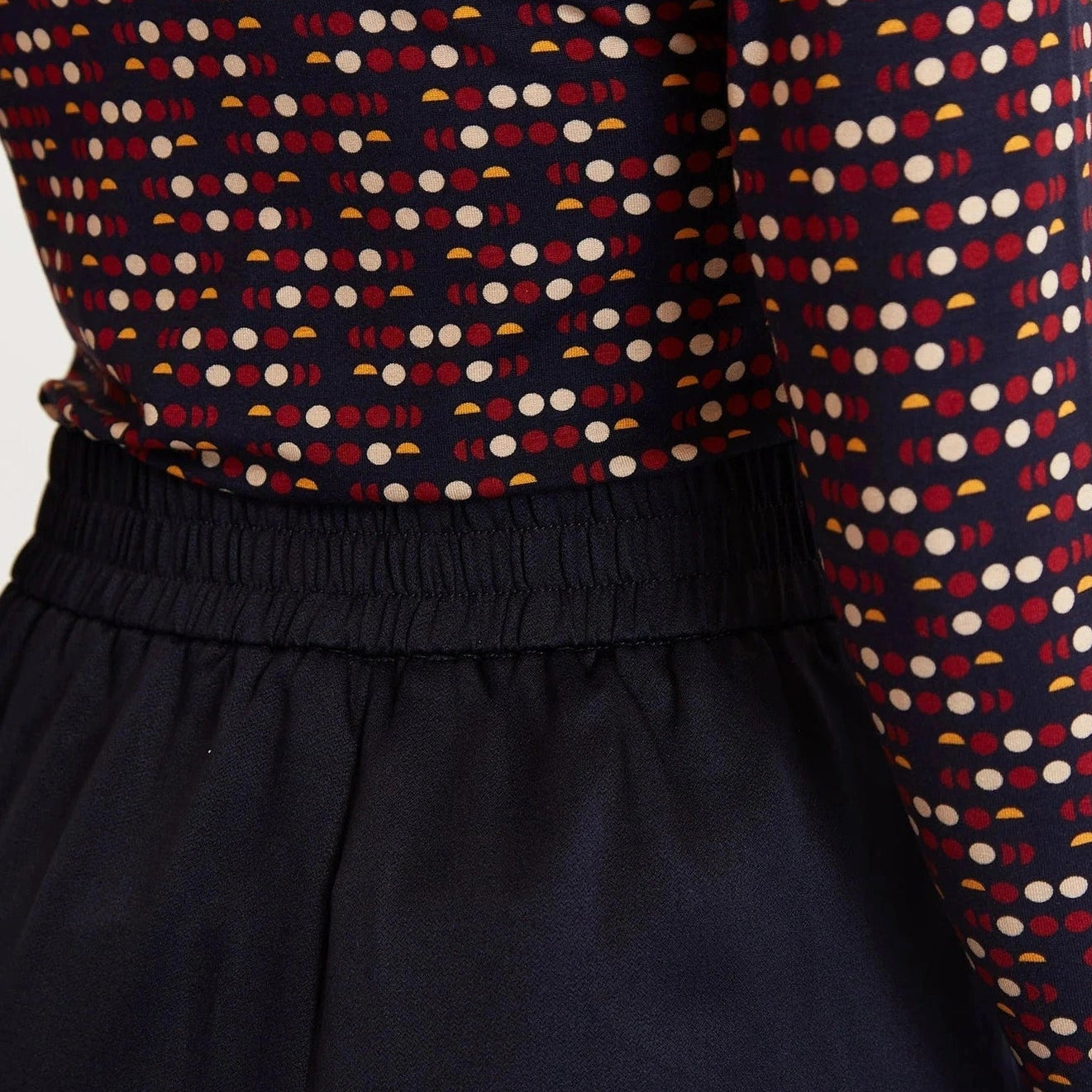 Patterned long-sleeve top with a dark background