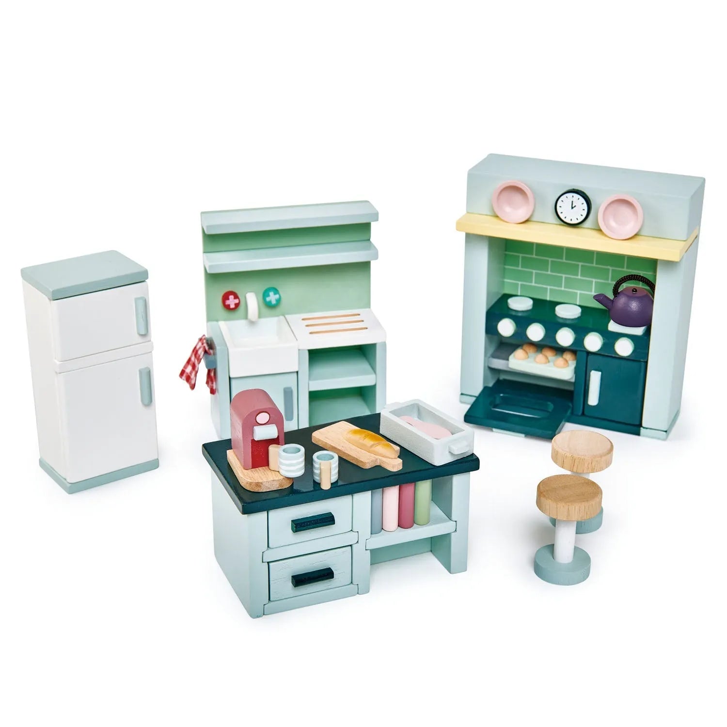 Set of toy dolls' house kitchen furniture and accessories on a white background