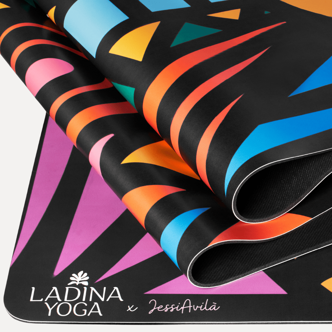 Colorful yoga mat with geometric patterns and Ladina Yoga branding.
